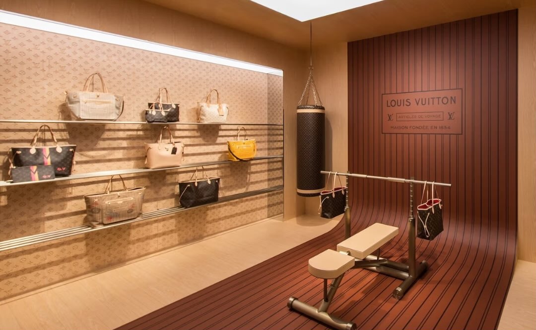 Luxury handbags displayed in gym setting
