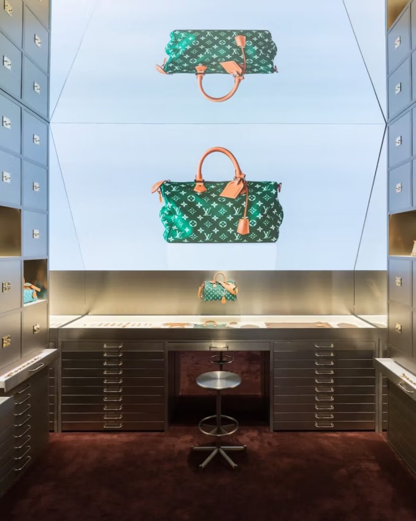 Luxury handbags displayed in modern showroom